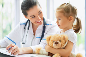 Pediatric care specialist with a child.